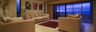 Guest lounge with stacking sliding doors creating indoor to outdoor opening on 2 sides.